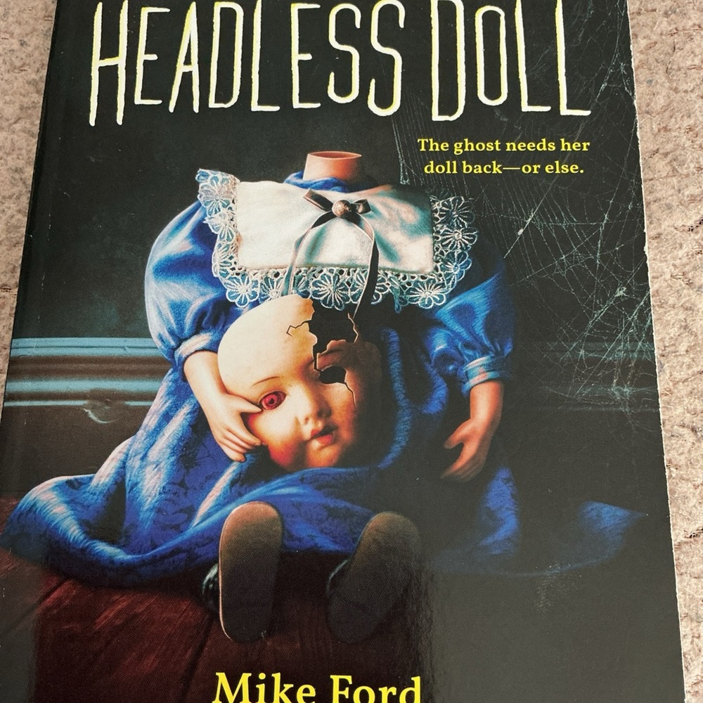Headless Doll by‎ - Blue and Black Cover